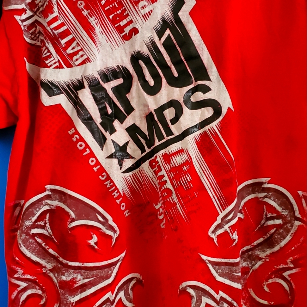 Dominate the competition in style with Tapout's red MPS shirt